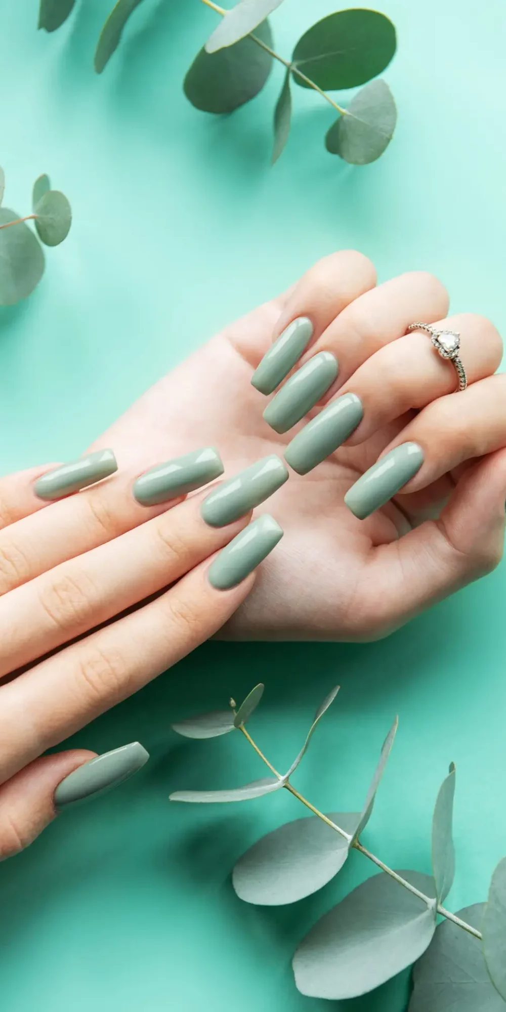Brightly,Polished,Long,Green,Nails,Are,Elegantly,Arranged,On,A Brightly,Polished,Long,Green,Nails,Are,Elegantly,Arranged,On,A